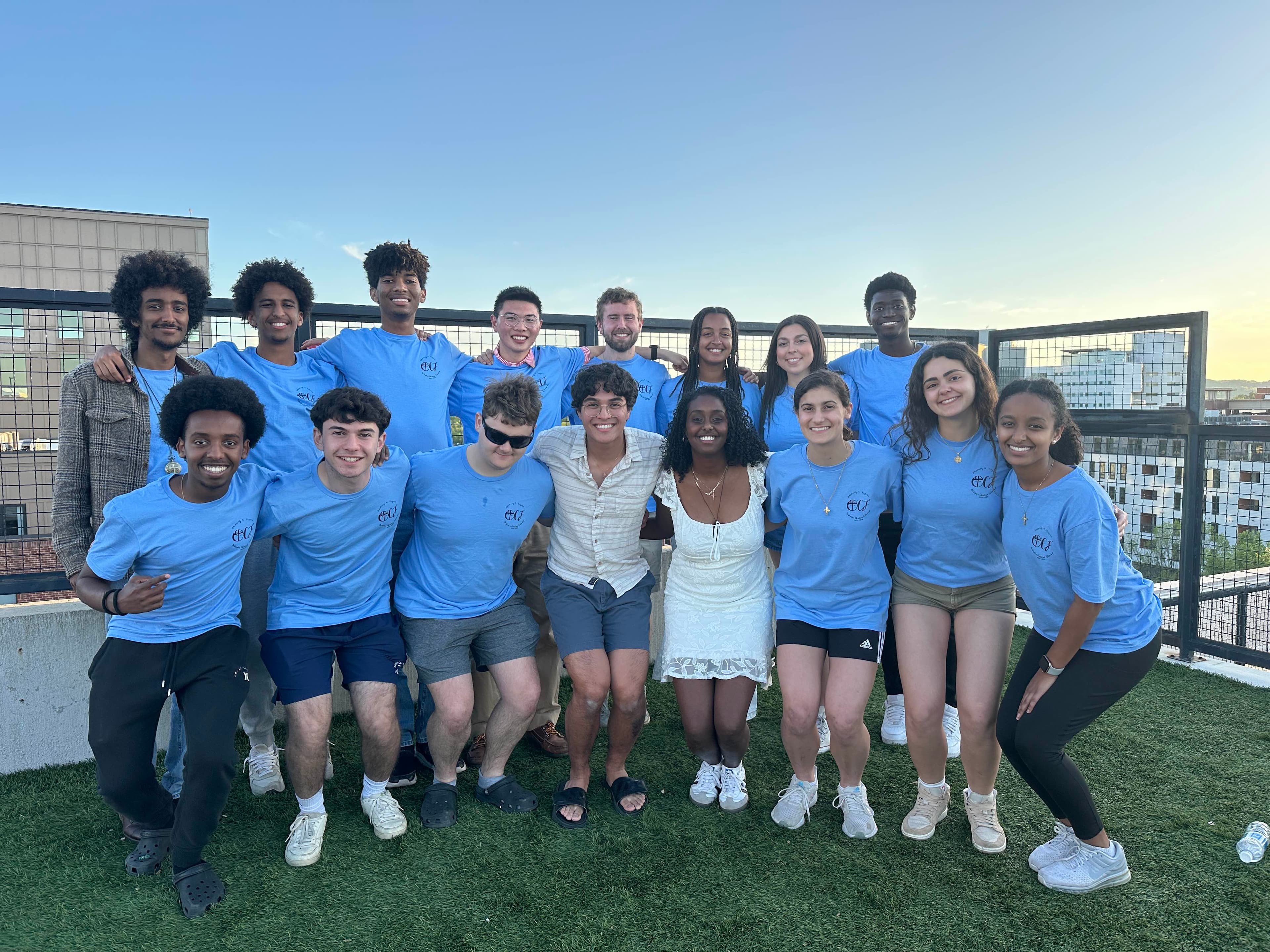 Students gathered around food at the spring cookout