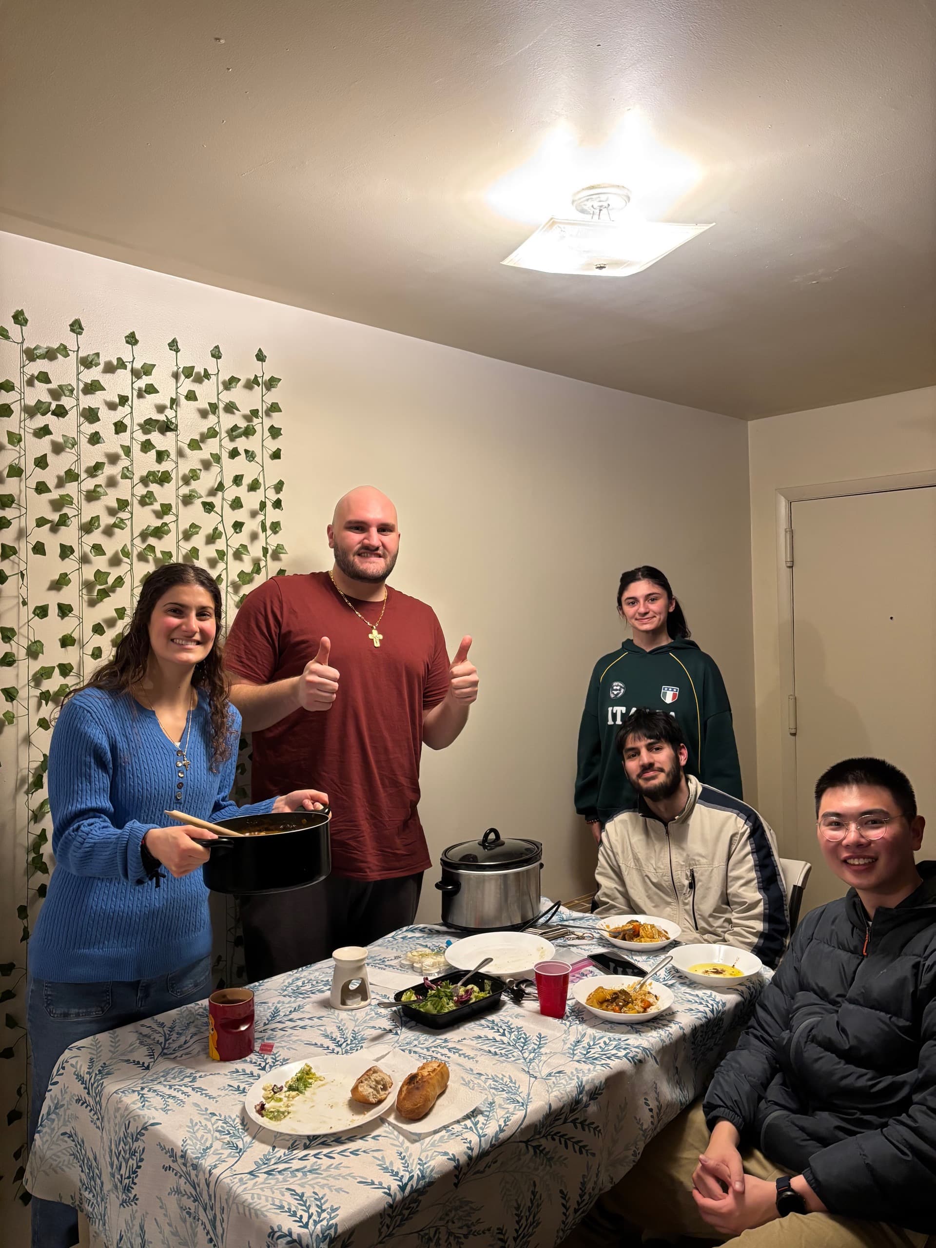 Students sharing a home-cooked dinner together