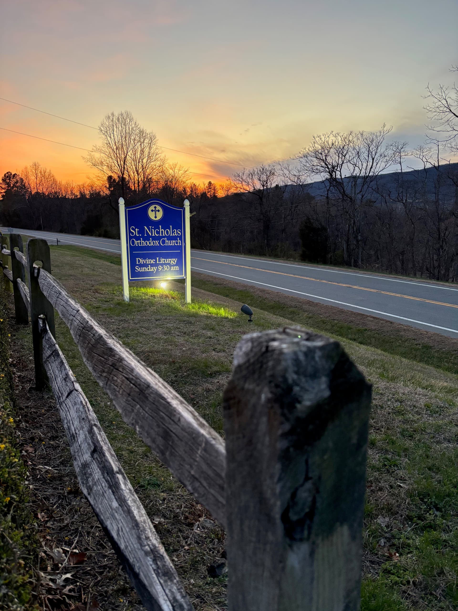 The sign for St. Nicholas Orthodox Church at sunset
